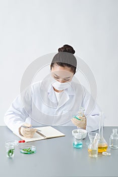 The scientist, dermatologist formulate organic natural cosmetic product in the laboratory photo