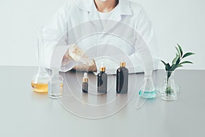 The scientist, dermatologist testing the organic natural cosmetic product in the laboratory