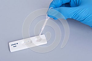 Scientist or doctor hand using Rapid antigen test cassette quick fast testing identifying antibodies for COVID-19 Coronavirus is