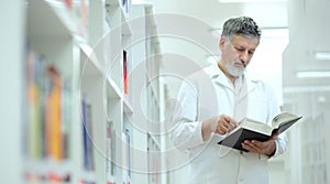 Scientist/doctor in a library