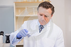 Scientist doing experimentations in flask