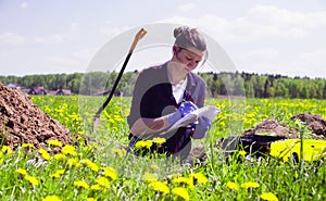 Scientist ecologist writing something on envelope. photo