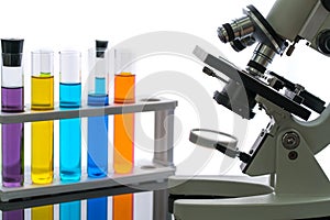 Scientist with equipment and science experiments, laboratory glassware containing chemical liquid for research or analyzing a