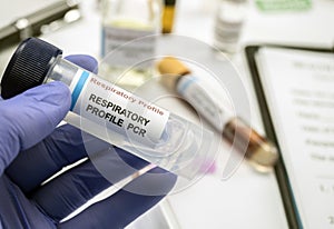 Scientist examines sample of coronavirus in laboratory