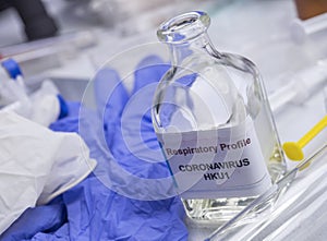 Scientist examines sample of coronavirus in laboratory