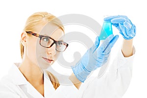Scientist Examining Chemical In Beaker