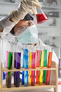 Scientist examining chemical solution