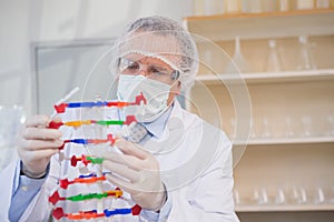 Scientist examining dna helix