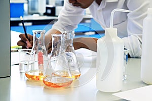 Scientist experiment chemical research in science laboratory