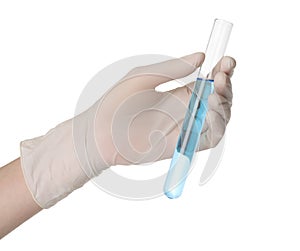 Scientist in gloves holding test tube with light blue liquid on white background, closeup