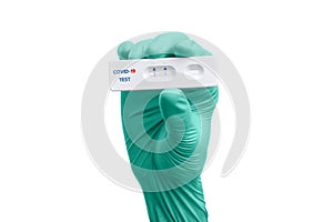 Scientist hand showing rapid test kit for viral disease COVID-19 2019-nCoV with positive result. Lab card kit test for viral sars-