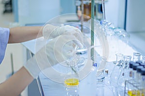 Scientist hand titration at laboratory