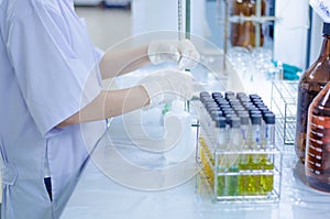 Scientist hand titration at laboratory