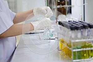 Scientist hand titration at laboratory