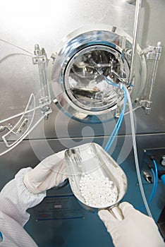Scientist hand working at pharmacy microbiology laboratory