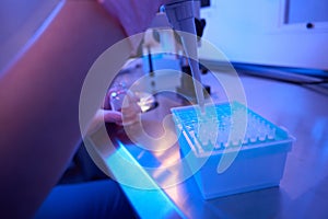 Scientist hands preparing biological samples for storage