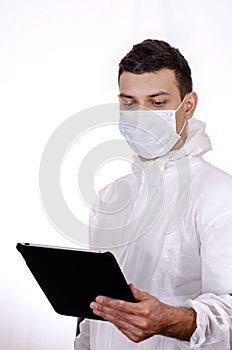 Scientist holding and looking at tablet computer