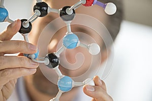 Scientist Holding Molecular Structure