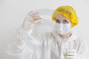 Scientist holding pill