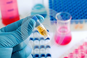 Scientist holding a test tube in a research lab