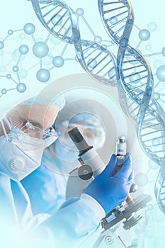 Scientist holding vaccine bottle in hand in modern clinical laboratory with microscope