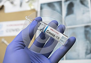 Scientist holds a coronavirus vaccine