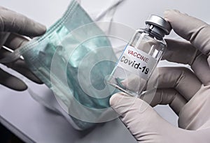 Scientist holds a coronavirus vaccine