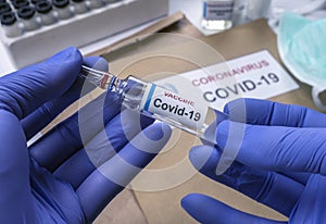 Scientist holds coronavirus vaccine in hospital