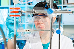 Scientist holds and examine samples in a laboratory