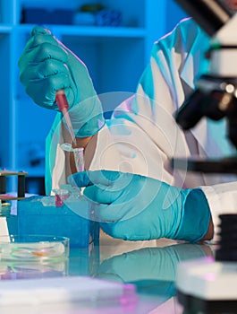 Scientist holds and examine samples in a laboratory
