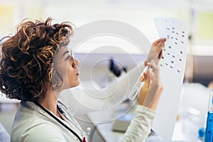 Scientist looking at DNA in laboratory