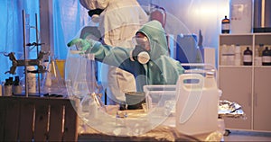 Scientist, man and flask with liquid on gas for danger in lab as experiment with nitrogen, chemicals and spray for