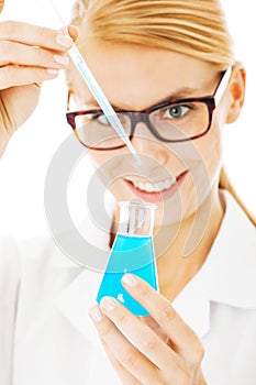 Scientist Mixing Chemical In Beaker