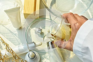 Scientist mixing natural skincare beauty products, Organic botany extraction and scientific laboratory glassware