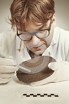 Archaeologist researcher taking samples of cuneiform material