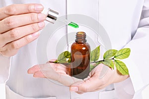 Scientist with natural drug research, Green herbal medicine discovery at science lab.