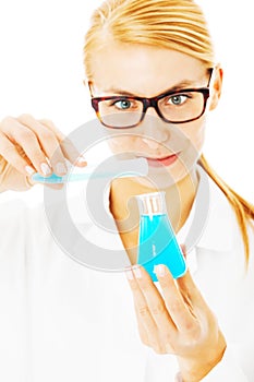 Scientist Pouring Chemical In Beaker