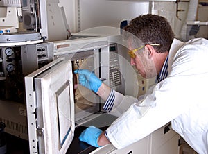 Scientist prepares chromatograph oven
