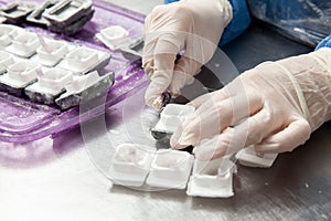 Scientist preparing paraffin blocks containing biopsy tissue for sectioning. Pathology laboratory. Cancer diagnosis photo