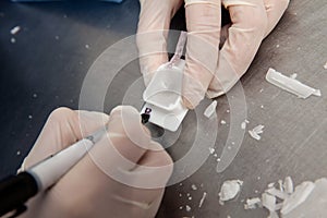 Scientist preparing paraffin blocks containing biopsy tissue for sectioning. Pathology laboratory. Cancer diagnosis photo