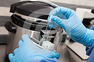 Scientist preparing slides with tissue samples for immunohistochemistry assay in the laboratory. Scientist at the