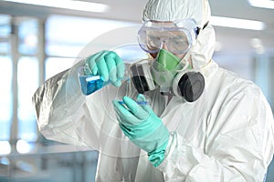 Scientist in protective clothing working