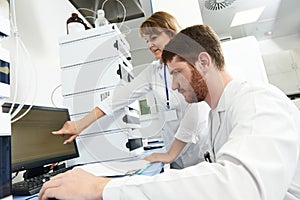 Scientist researcher team works in laboratory
