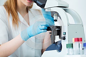 Scientist researcher using microscope in laboratory. Medical healthcare technology and pharmaceutical research and