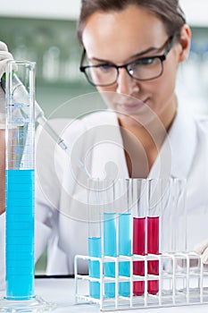 Scientist researcher using a pipette and test tubes