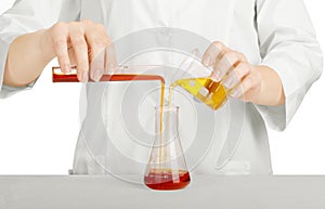 Scientist's hand holding a glass test tube