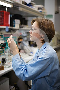 Scientist with syringe