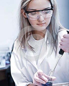 Scientist with test tubes