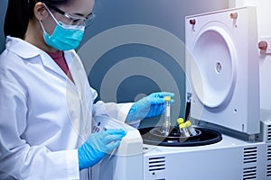 Scientist used the centrifuged machine to separate sample extraction from the solution.