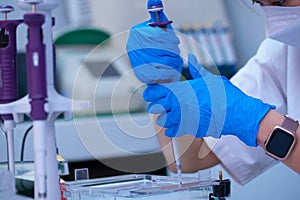 scientist using auto-pipette with Eppendorf consumables tube in the lab,Doing experiment for product